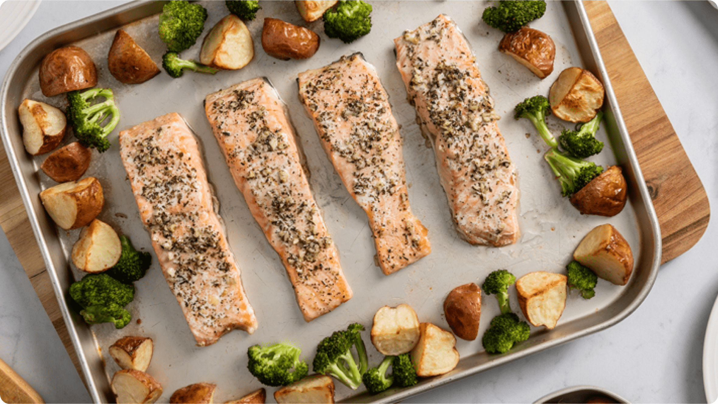 Sheet Pan Salmon with Potatoes and Broccolis